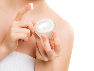 Skin care. Moisturizing cream in female hands