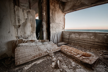 The interior of a building in ruins on the coast of Sicily.