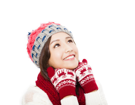 young beautiful woman in winter clothes and looking up - isolate