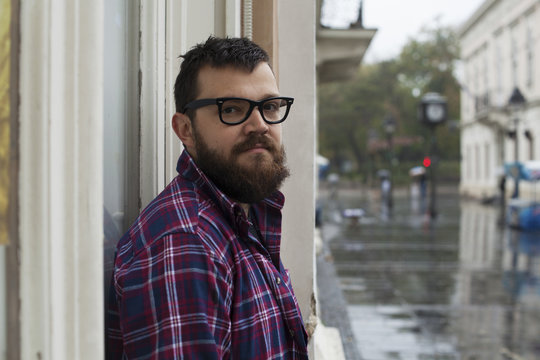 Portrait Of Man With Beard And Glasses Outdoors