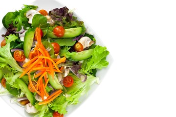 Plate of vegetable salad on white