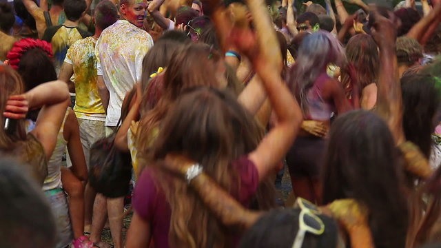 Young girls and guys having fun at event, dancing crowd