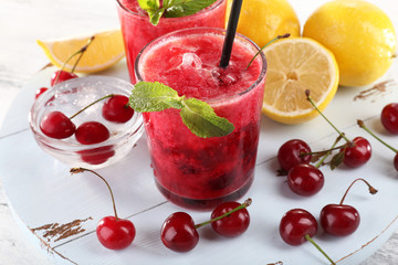Fresh cold cherry cocktail with mint and lemon
