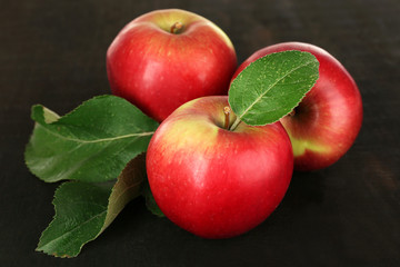 Ripe apples on wooden background