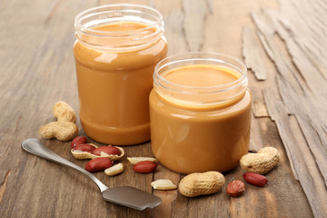 Creamy peanut butter on wooden table