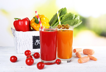 Vegetable juice and fresh vegetables in wooden box