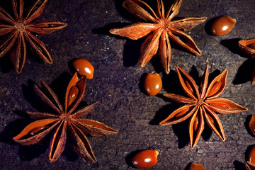 Stars anise on wooden background