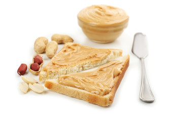 Slices of bread with creamy peanut butter, isolated on white