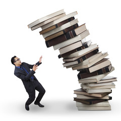 Businessman with falling books