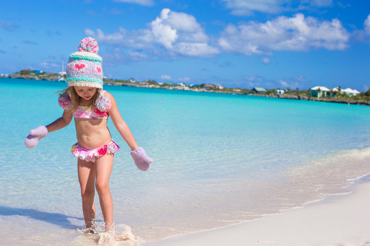 Little cute adorable girl on tropical beach
