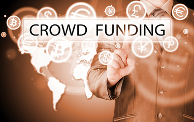 Businessman pushes virtual crowd funding button