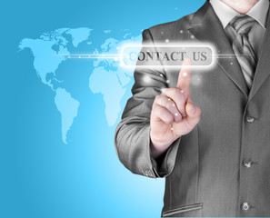 businessman hand pushing contact us button