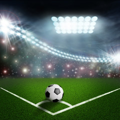 soccer ball on the green field corner