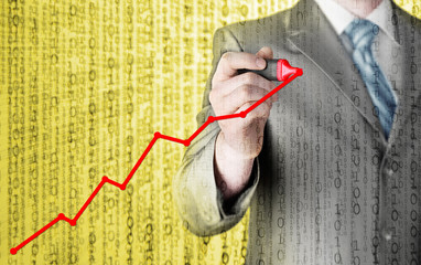 Business man drawing a growing graph