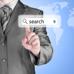 Businessman pushing virtual search bar