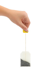 Hand and tea bag