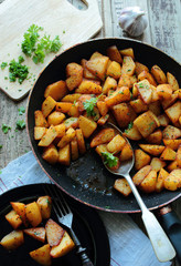 Fried potatoes with fresh parsley herbs