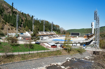 Fototapeta na wymiar Medeo Stadium. Outdoor speed skating in mountain valley