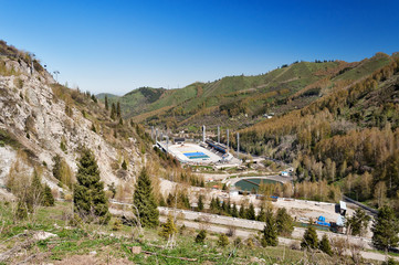 Fototapeta na wymiar Medeo Stadium. Outdoor speed skating in mountain valley