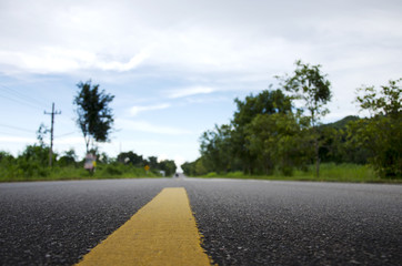 Fototapeta na wymiar Road in countryside low angle with blurred background