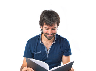 Man reading a book over white background