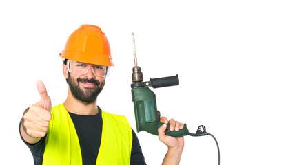 workman with drill over white background