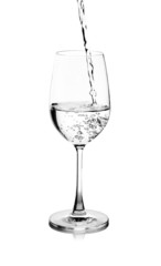 pouring water on a glass on white background