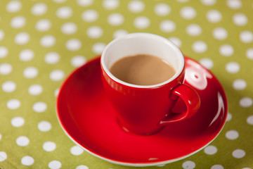 Cup with coffee on a table.