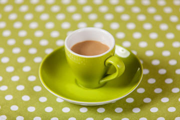 Cup with coffee on a table.