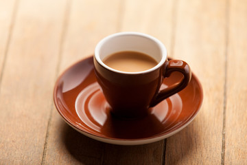 Color cup on a wooden table.