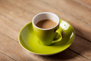 Color cup on a wooden table.