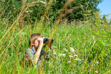 Child looking through binoculars
