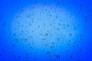 Blue water drops on the mirror