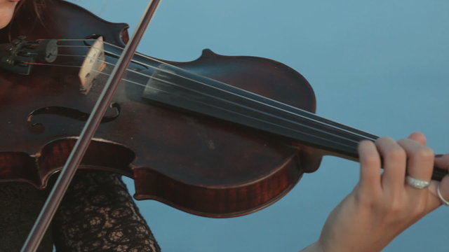 Girl emotionally plays the violin