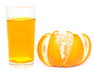 orange and glass of juice on a white background