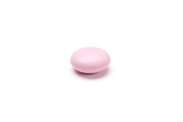Obraz na płótnie Canvas Pink tablet, isolated on white. Healthcare concept