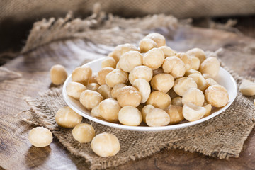 Fototapeta na wymiar Bowl with Macadamia nuts