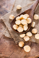 Wooden spoon with Macadamia nuts