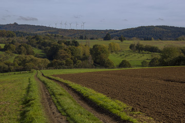 Fototapeta na wymiar farmland with wind turbines