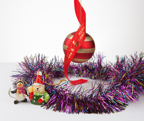 Christmas bauble and decorations with tinsel isolated on white