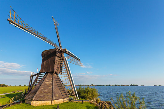 Old wooden windmill in the Dutch province of Friesland