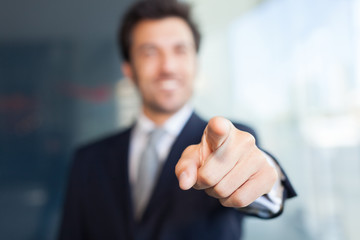 Businessman pointing his finger at you - obrazy, fototapety, plakaty