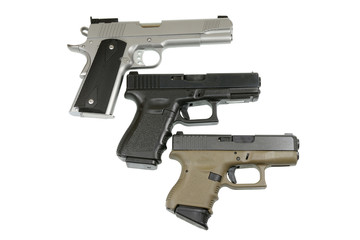 three pistols on white background