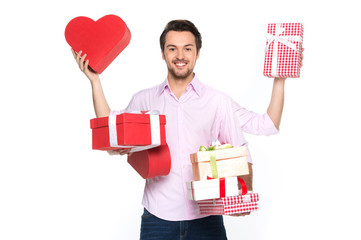 Man holding presents wrapped in gift paper, isolated on white.