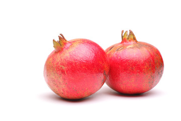 Studio shot of two pomegranates