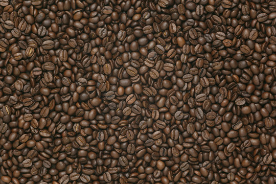 Caffe edition, coffee beans on old brown paper