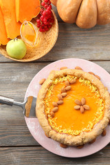 Homemade pumpkin pie on table