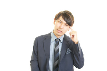 頭痛を訴えるビジネスマン