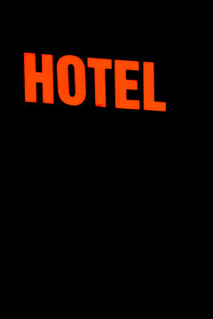 Neon Sign with the word Hotel.
