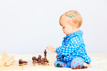 cute little girl playing chess